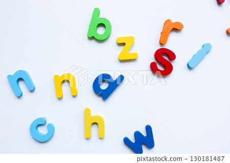 Colorful alphabet letters scattered on white background Colorful alphabet letters scattered on white background 130181487