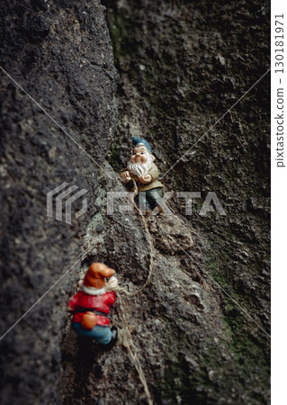 Two figurines depicting dwarves climbing Sokolik Duzy Mountain,  funny trend in Polish mountains 130181971