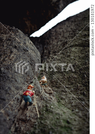 Two figurines depicting dwarves climbing Sokolik Duzy Mountain,  funny trend in Polish mountains 130181972