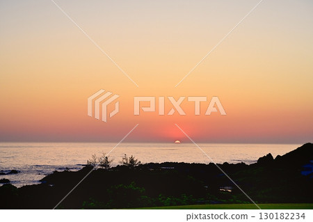 The sun setting over the Sea of Japan on the reefs of Oura in the Aikawa district of Sado Island The sun setting over the Sea of Japan on the reefs of Oura in the Aikawa district of Sado Island 130182234