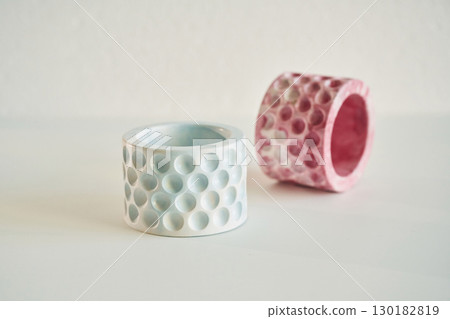 Capacity for candles on the creamy white surface Capacity for candles on the creamy white surface 130182819