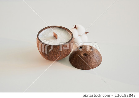 Coconut shape. Handmade beautiful decorative candles on the background Coconut shape. Handmade beautiful decorative candles on the background 130182842