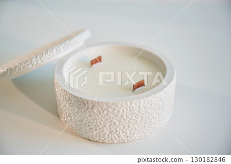 On white background. Handmade beautiful decorative candle 130182846