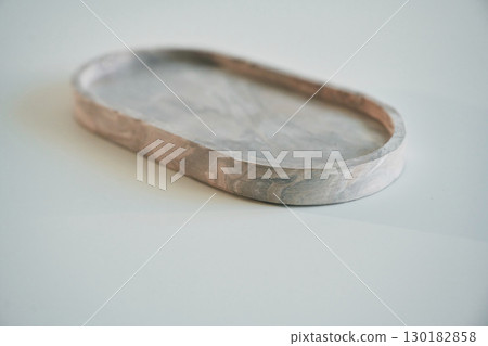 Capacity for candle on the white surface 130182858