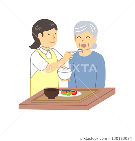 A caregiver assisting elderly people with meals 130183084