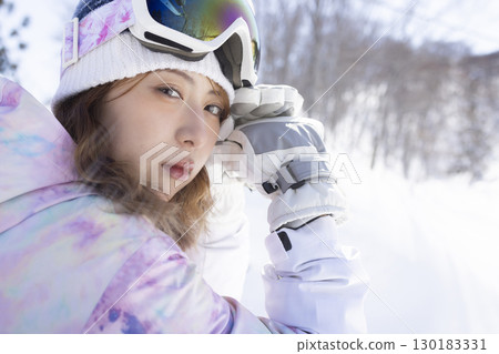 Cute woman enjoying the snow 130183331