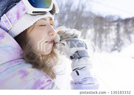 Cute woman enjoying the snow 130183332