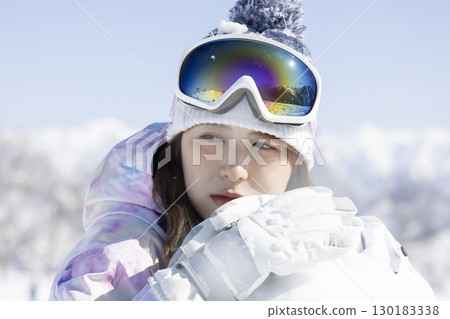 Cute woman enjoying the snow 130183338