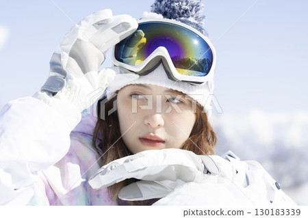 Cute woman enjoying the snow 130183339