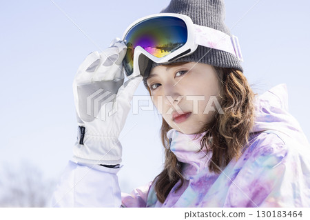 Cute woman enjoying the snowy mountains 130183464