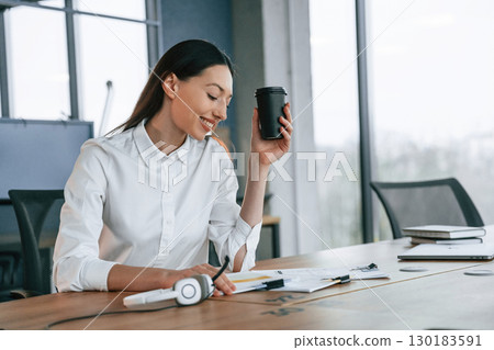 Daily routine work. Businesswoman is indoors in the office 130183591