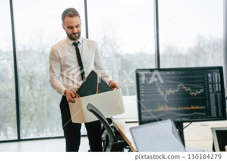 Sad person. Unemployed man is with personal belongings after being fired Sad person. Unemployed man is with personal belongings after being fired 130184279