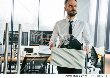 Sad person. Unemployed man is with personal belongings after being fired Sad person. Unemployed man is with personal belongings after being fired 130184281