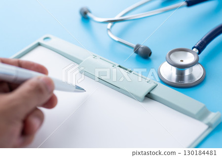 Blue stethoscope and binder 130184481