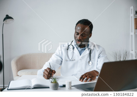 Black man as doctor in the clinic office Black man as doctor in the clinic office 130184822
