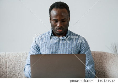 Freelancer is working at home by laptop 130184942