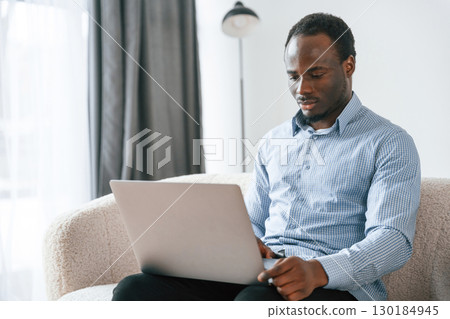 Freelancer is working at home by laptop Freelancer is working at home by laptop 130184945