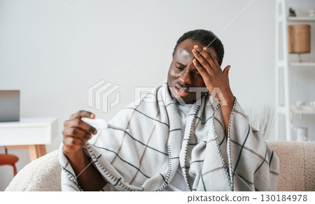 Horrible headache. Sick black man is at home Horrible headache. Sick black man is at home 130184978