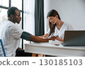 Healthcare conception. Female doctor measures blood pressure of a man 130185103