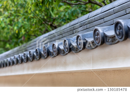 Ornamental kawara tiles detail from traditional Himeji Castle 130185478