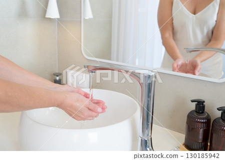 Handwashing is crucial in a modern bathroom for cleanliness, comfort, and wellness 130185942