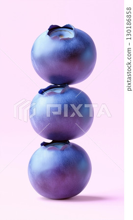 A stack of blueberry fruit balancing on top with pink solid background 130186858