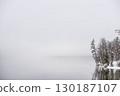 Fog covered winter lake Bohinj 130187107