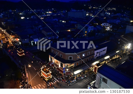 Takayama City, Gifu Prefecture, Japan: Spring Takayama Festival Night Festival: Lantern floats parading after sunset: Aerial view of the street Takayama City, Gifu Prefecture, Japan: Spring Takayama Festival Night Festival: Lantern floats parading after sunset: Aerial view of the street 130187530