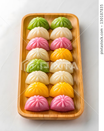 Delicious chuseok festive treats on a wooden tray for korean thanksgiving celebration 130187835