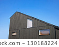 Housing image: Newly built house with burnt cedar boards on the exterior walls 130188224