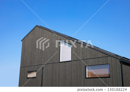 Housing image: Newly built house with charred cedar board exterior walls and no eaves Housing image: Newly built house with charred cedar board exterior walls and no eaves 130188224