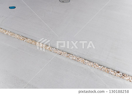 Parking lot concrete joint gravel joint 130188258