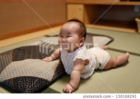 A 6-month-old baby girl smiling in a tatami room A 6-month-old baby girl smiling in a tatami room 130188291