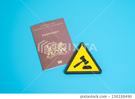 Netherlands citizen's passport and the symbol of the court process. Obtaining citizenship through the court, migration law, legal immigration, refugee rights, EU residency, naturalization issues 130188490