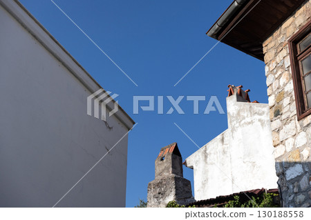 Marmaris, Turkey. A charming view of a rustic stone building under blue sky 130188558