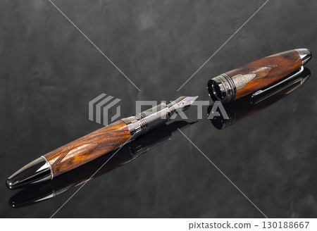 Fountain pen on dark marble background. Rare writing instruments. 130188667
