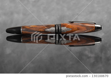 Fountain pen on dark marble background. Rare writing instruments. Fountain pen on dark marble background. Rare writing instruments. 130188670