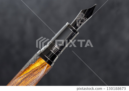 Fountain pen on dark marble background. Rare writing instruments. 130188673