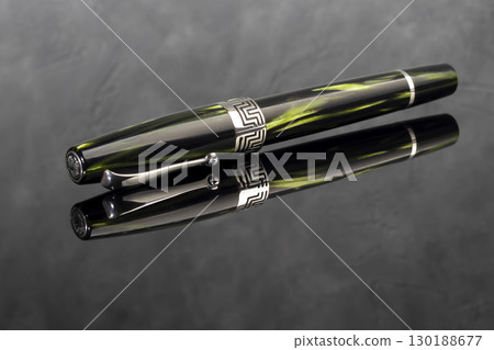Fountain pen on dark marble background. Rare writing instruments. 130188677