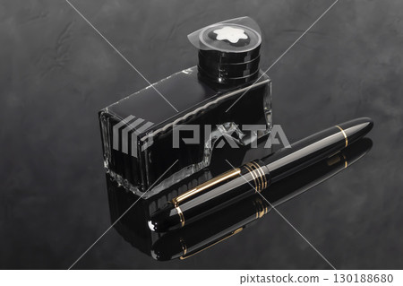 Fountain pen on dark marble background. Rare writing instruments. Fountain pen on dark marble background. Rare writing instruments. 130188680