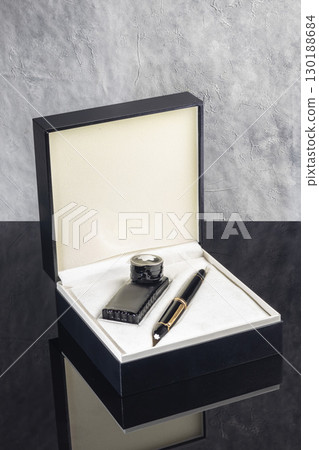 Fountain pen on dark marble background. Rare writing instruments. 130188684