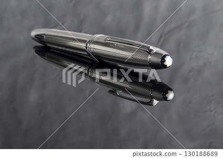 Fountain pen on dark marble background. Rare writing instruments. 130188689
