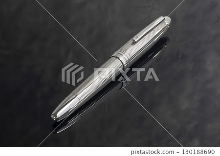 Fountain pen on dark marble background. Rare writing instruments. 130188690