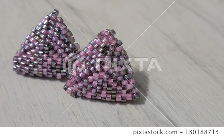 Bracelet and earrings made of beads on a light background. Handmade. Jewelry 130188713