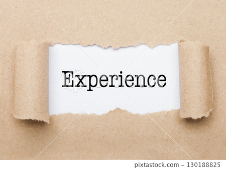 Experience text appearing behind torn brown paper Experience text appearing behind torn brown paper 130188825