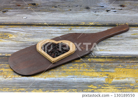 Healthy dried fruit. Dried grapes. Healthy food organic nutrition. Raisin dried grape. Heart Shape. 130189550