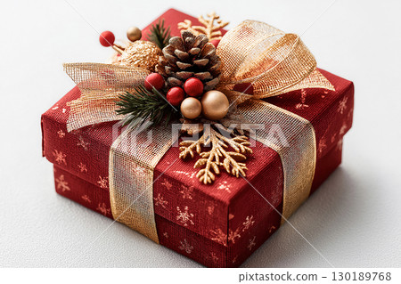 Stylish wrapping. Christmas Gift Box with a sprig of pine on white background. Christmas traditions and seasonal joy. Stylish wrapping. Christmas Gift Box with a sprig of pine on white background. Christmas traditions and seasonal joy. 130189768