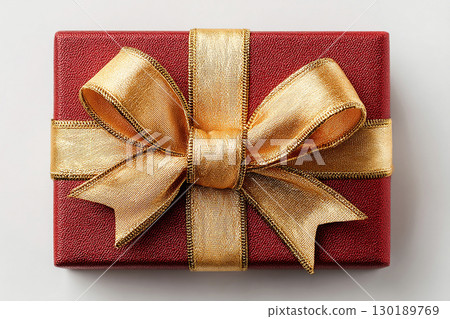 Premium gift. Festive season. Classic Red Gift Box with Gold bow on white background. Representing Christmas. 130189769