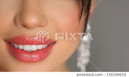 Beautiful female smile with beautiful teeth close-up. 130190058
