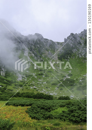The green and misty mountain scenery of Senjojiki Cirque in summer The green and misty mountain scenery of Senjojiki Cirque in summer 130190169